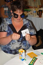 Teacher wearing occluders performs a task